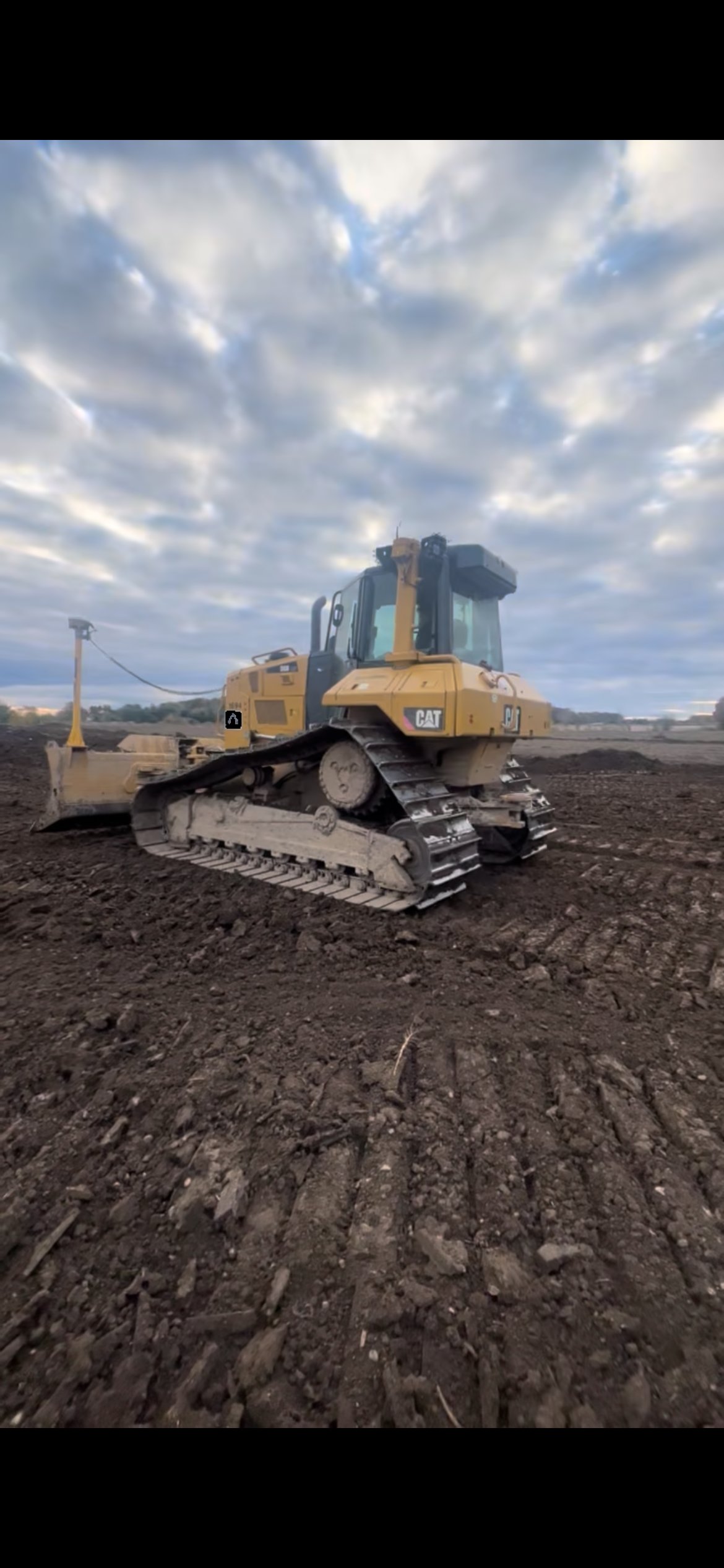 Bulldozer grading a cleared job site